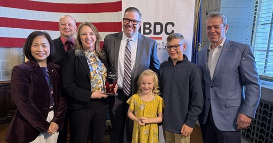 K.C. Belitz, Chancellor Li, Stacy and Dustin Dam & family, Gov. Pillen Innovation Business of the Year